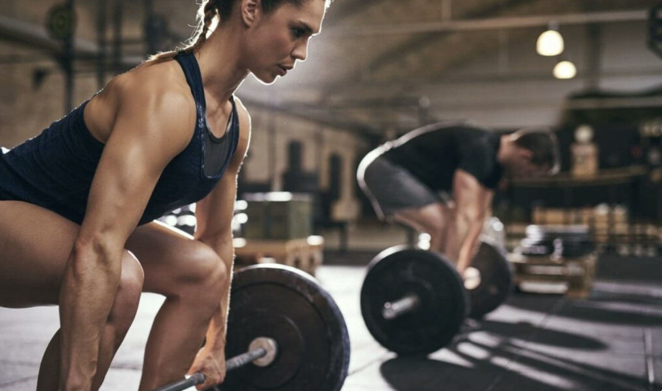 Woman strength training in a gym